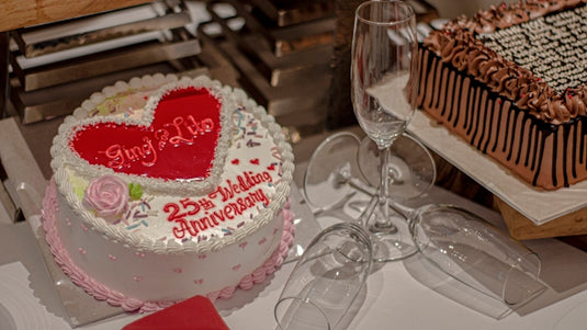 white and pink cake on white table