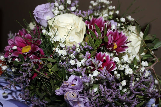 a bouquet of flowers sitting on top of a table