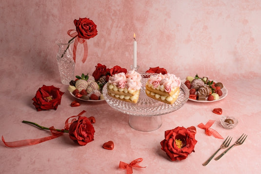 a table topped with a cake covered in frosting