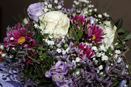 a bouquet of flowers sitting on top of a table