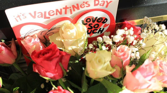 Roses and a valentine's day card saying loved so much