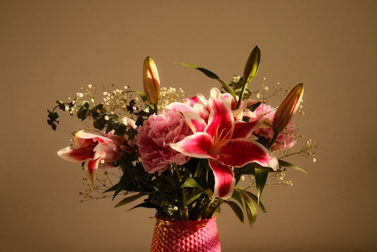 A beautiful bouquet of pink lilies and carnations.